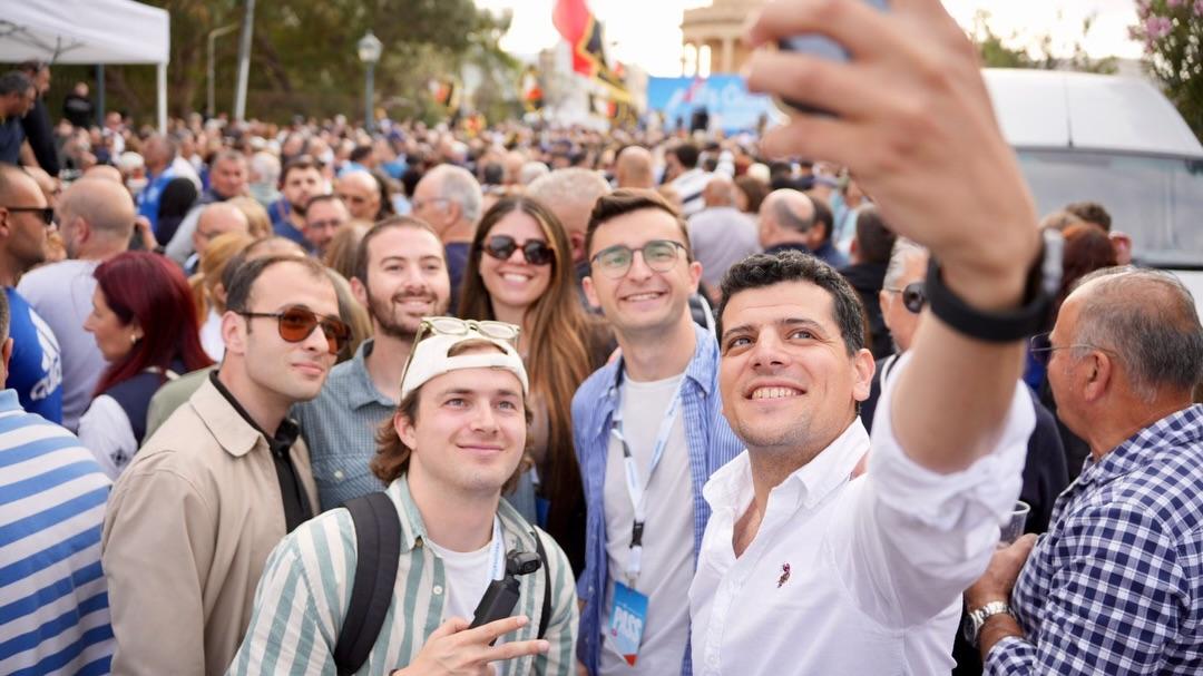 Beppe Galea taking a selfie with supporters at a mass rally